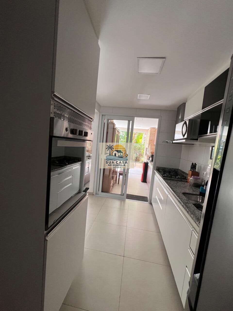 apartamento venda 2 dormitorios 1 suite 2 vagas sacada gourmet enseada guaruja AP201E